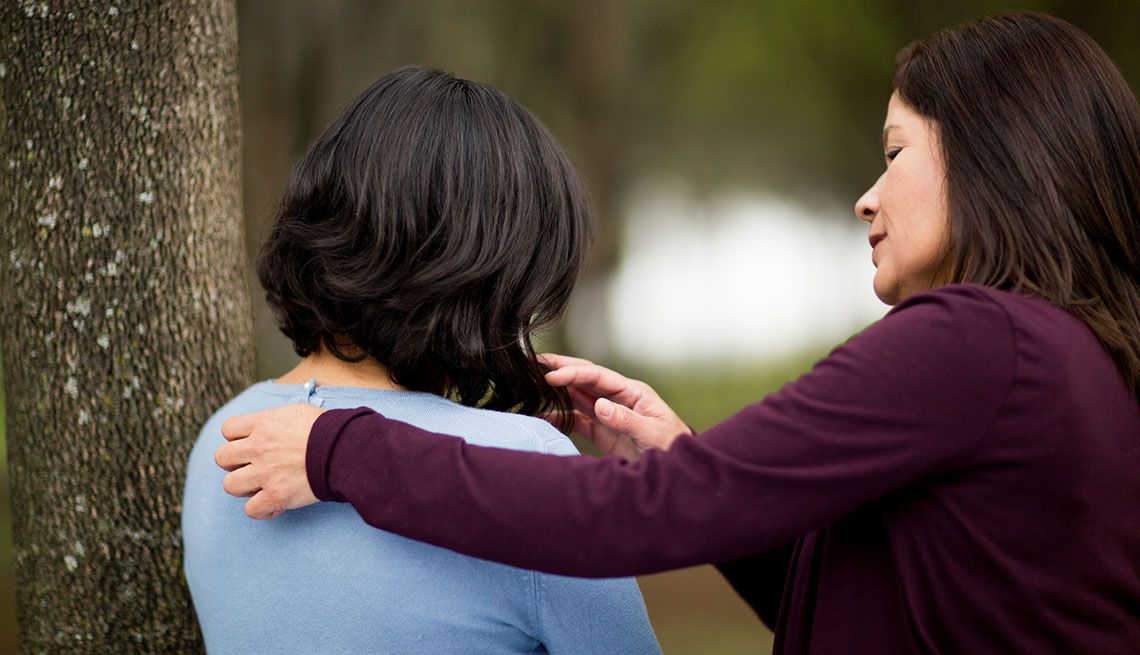 Mother consoling her daughter